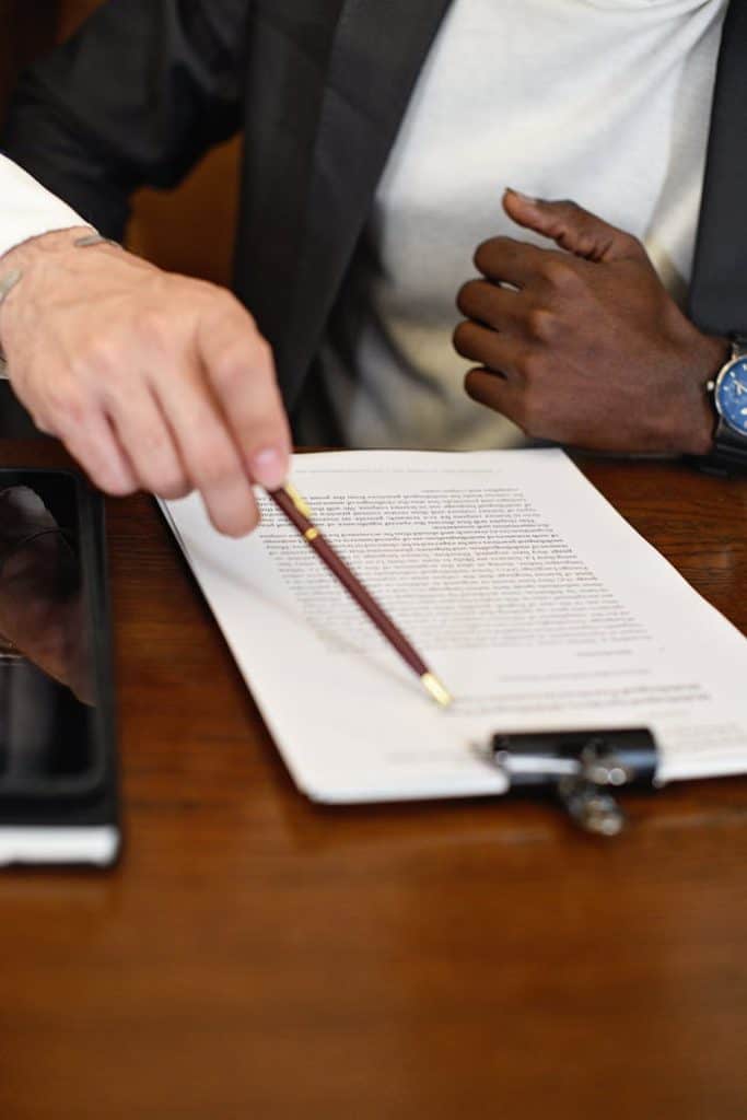 Business professional reviewing legal documents at Dario Vidal Law Firm.