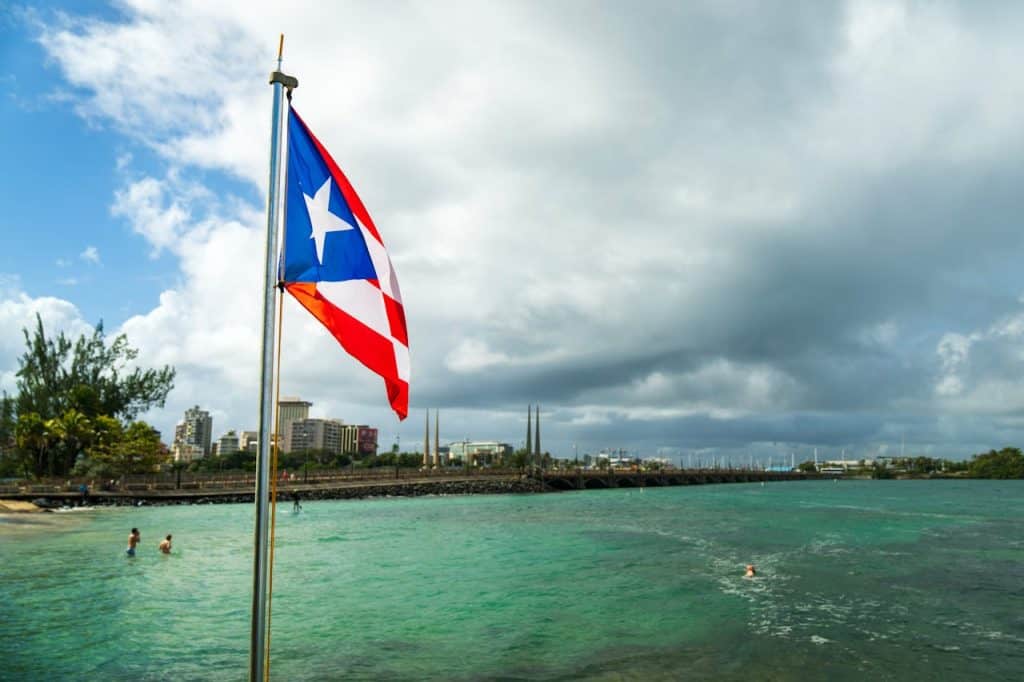 Puerto Rico flag at the beach, law firm office in San Juan.